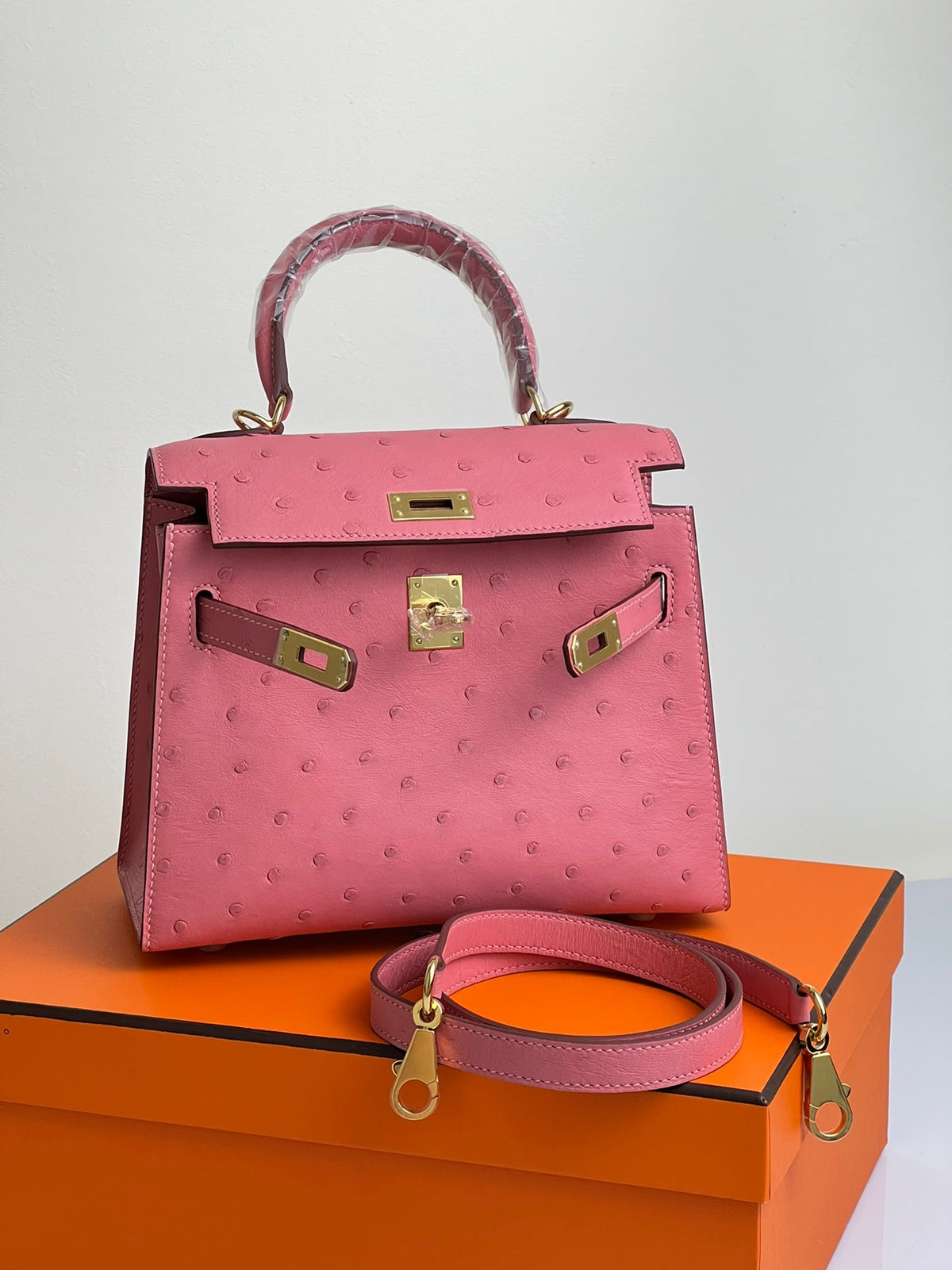 KELLY BAG 20 IN ROUGE PINK OSTRICH LEATHER WITH GOLD HARDWARE (MADE - TO - ODER)
