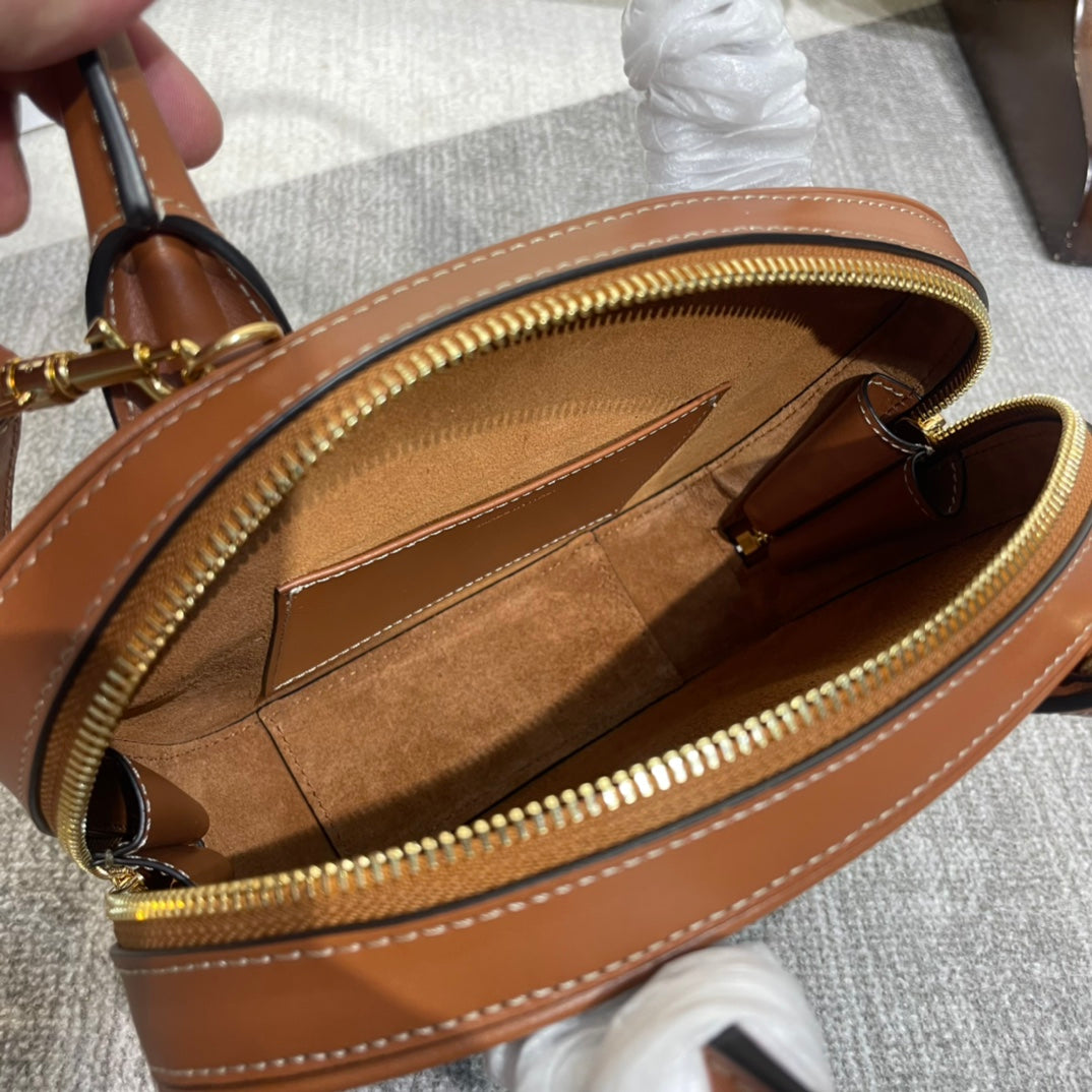 TRIOMPHE TOP HANDLE BAG 20 IN BRONZE BROWN CALFSKIN